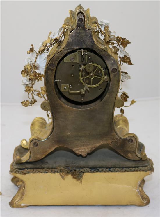 A 19th century French ormolu mantel clock, 8.5in., with additional giltwood plinth